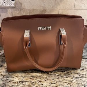 Brown Kenneth Cole Reaction bag.